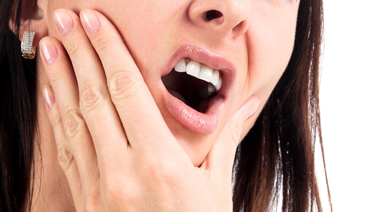 درمان تیر کشیدن دندان پر شده